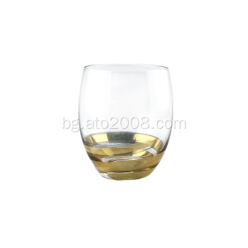 Прозрачна стъклена чаша със златна основа